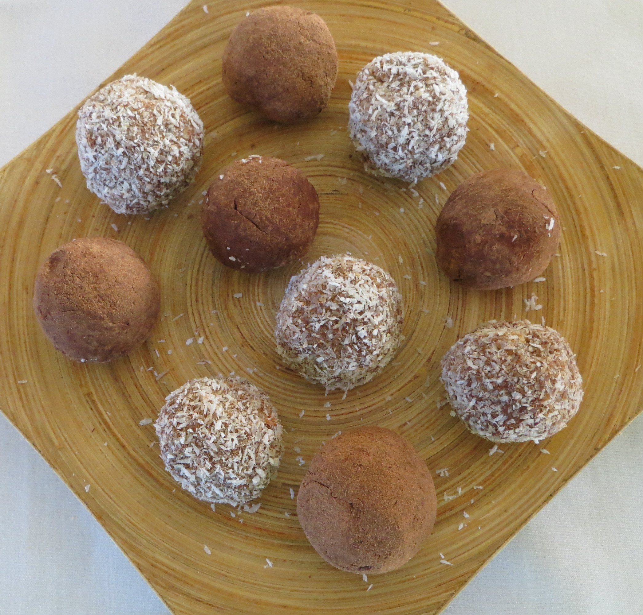 Mango and cocoa  truffles in a plate
