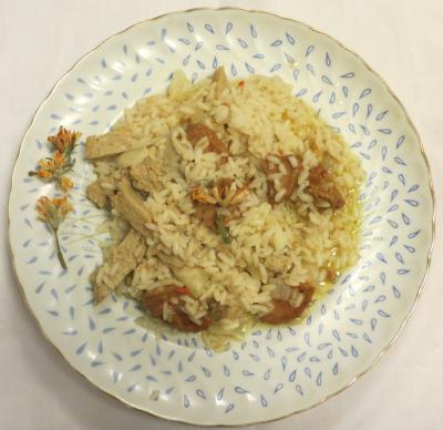 Dish with carqueja and seitan rice with a sprig of gorse
